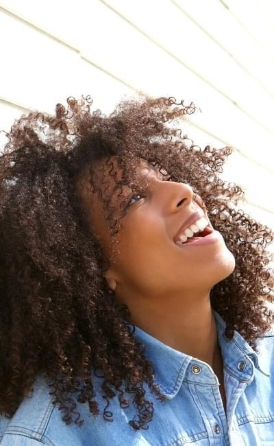 woman looking up and smiling